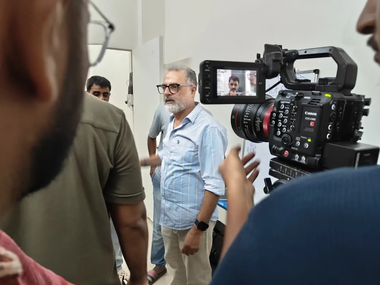 Participants checking frame and composition · FTII Digital Cinematography Workshop · Goregaon, Mumbai · 2026